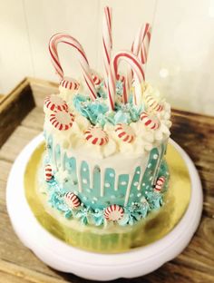 a cake decorated with candy canes and candies