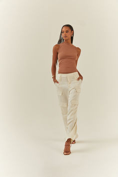 Woman in a Java colored form-fitting tank top and a pair of satin cargos, walking towards the camera. Ribbed Tank, New Classic, Basic Tank, Java, Wardrobe Staples, Mock Neck