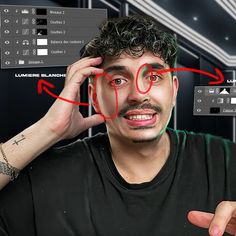 a man holding his head in front of the camera with red lines drawn on it