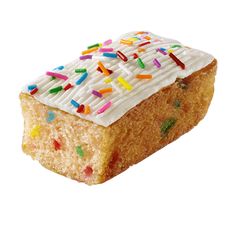 a piece of cake with white frosting and sprinkles on it's side