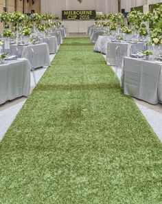 an indoor venue with tables and chairs set up for a wedding