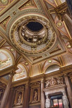 an ornately decorated ceiling in a building