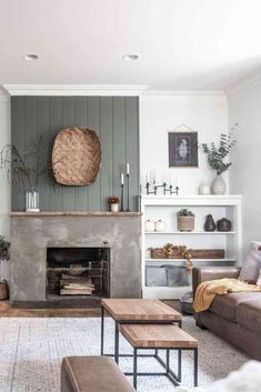 a living room filled with furniture and a fire place