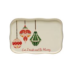 a white tray with three ornaments hanging from it's sides and the words eat drink and be merry