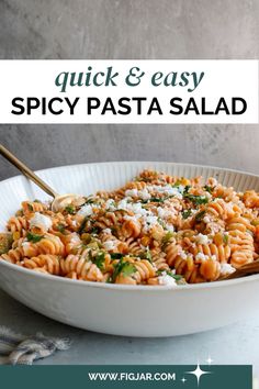 a white bowl filled with pasta and parmesan cheese