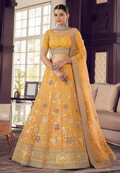 Yellow organza a line lehenga choli 9412  Desc:  Style : A Line Lehenga Choli Color : Yellow Fabric : Organza Work : Embroidery Wash Care : Dry clean Sleeve Style : Half Sleeve Long Sleeves : Done only in Custom Stitch Sleeves Lining : Done only in Custom Stitch Bust Size : 32 to 42 Inches Occasion : Wedding   Mehendi   Sangeet   Engagement   Reception   Ceremonial   Baby Shower. With Express Free Shipping and Custom Stitching, Buy Indian Party wedding wear Bridal Lehenga Choli Yellow organza a Turmeric Yellow, Orange Lehenga, Indian Wedding Lehenga, Choli Dress, Turquoise Blouse, Lehenga Dupatta, Yellow Lehenga, Organza Lehenga, Peach Art