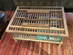 an old wooden crate sitting on top of a rug