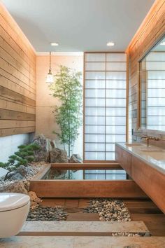 a bathroom with wood walls and stone flooring