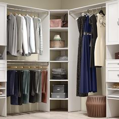 an organized closet with clothes and shoes