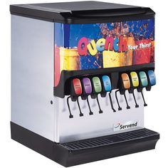 an image of a commercial coffee machine with drinks coming out of the top and on the bottom