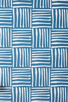 a blue and white wallpaper with lines drawn on the paper in different sizes, shapes and colors