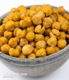 a bowl filled with chickpeas sitting on top of a table