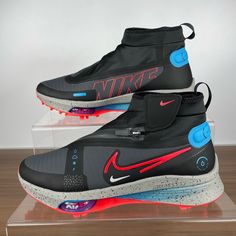 the nike air vapor is on display in a clear acrylic case with red and blue accents