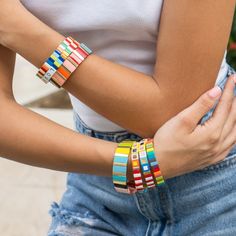 What can be more fun that these colorful, stackable, elastic bracelets? Each tile is handmade with an oil dripping technique and then beautifully arranged to complete the design. Wear just one or stack them all and see all the heads turn. These bracelets are that gift everyone loves to receive. - Care Instructions: Avoid contact with water, lotion, and perfume. Clean gently with a polishing cloth. Product Specifications: - Adds a touch of color to your wrist - Handcrafted with love and care - Ea Casual Multicolor Stackable Friendship Bracelets, Multicolor Stacked Bracelets As Gift, Playful Multicolor Stackable Bracelets, Trendy Multicolor Stackable Stretch Bracelet, Multicolor Stackable Stretch Bracelet As Gift, Perfume Clean, Tile Bracelet, Gold Tile, Elastic Bracelets