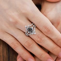 a woman's hand with a ring on it