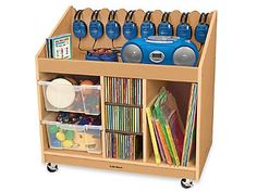 a wooden toy storage unit with cd's, cds and other items on wheels