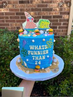 a blue cake with an image of spongebob on it and the words what's funnier than 24