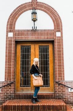 The Caroline bag is the ultimate versatile work, travel tote, and laptop bag. Wear it as a backpack or crossbody, or use the top handles for grab-and-go carry. Caroline's ergonomic, permanently anchored, padded vegan leather backpack straps zip up entirely in the back and tuck in at the bottom next to the luggage trolley sleeve. She’s yours to carry from the commuter train to the boardroom. With its wipeable interior, insulated snack/water bottle pocket, and ten spacious pockets, this work tote Lily Jade, Large Water Bottle, Unicorn Bag, Vegan Leather Backpack, Luggage Trolley, Faux Leather Bag, Work Tote, Vegan Leather Bag, Vegan Bags