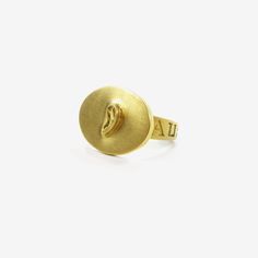 Details Gabriella Kiss 18k love token ring – “auscultare” – to listen, size 7. The oval plaque measures approximately 3/4″ x 1/2″, with the band tapering from 5 mm to 3 mm. - 18k yellow gold - size 7 Sizing Due to the nature of this ring, it cannot be resized. Appropriate sizes can be special ordered, please allow 2 - 6 weeks. Inquire to order. Yellow Gold Brass Engraved Ring For Promise, Yellow Gold Oval Dome Ring In Brass, Anniversary Yellow Gold Brass Dome Ring, Gabriella Kiss, Mirror Paper, Engagement Necklaces, Sparkly Ring, All Band, Love Token