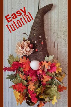 an easy fall wreath made out of burlock and fake leaves with the words easy tutorial written above it