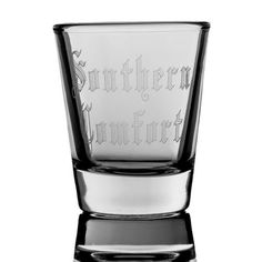 an old fashioned shot glass with the word's name etched on it, sitting in front of a white background