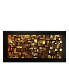 a large metal wall sculpture with squares on it's sides and gold foil in the middle