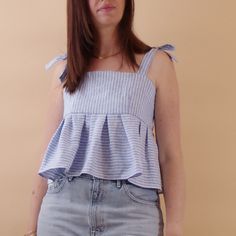 The cutest top you would ever wear. A sweet and delicate top in 100% linen with blue stripes. Available only in size S. Easy to wear in summer over vintage jeans or wide leg pants. Leave it a bit loose or tighten it up as you wish thanks to the straps on the back and on the shoulder. *Actual color may vary from picture due to computer settings. -Care- Hand wash or gently machine washable. Air dry SIZES S (MOSTLY US 6, EU 38, IT 42, UK 10, AU/NZ 12, JP 11) BODY measurements: - bust 86 - 90 cm // Summer Light Wash Tops With Ruffles, Light Wash Linen Tops For Summer, Summer Light Wash Linen Tops, Summer Striped Tops With Ruffles, Striped Sleeveless Cotton Top, Striped Linen Top With Button Closure, Classic Blue Horizontal Stripe Tops, Classic Blue Horizontal Stripe Top, Vintage Striped Top With Button Closure