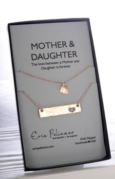 A new take on our popular Mother Daughter sets. These sets offer your choice of sterling silver, rose gold or yellow gold dipped. And include additional daughter necklaces, to represents the lifelong bond and love between mothers and daughters. The mother's necklace is a 1.5" hammered bar necklace with a single heart cut out (all daughter selections include a single heart cut out on the Mom necklace) on an 18" coordinating beaded chain. The daughter's necklace is a hammered heart on either ... Mom Daughter Jewelry, Mother Daughter Necklaces Set, Mother Daughter Necklace, Mother Daughter Gifts, Daughter Jewelry, Daughter Necklace, Gold Bar Necklace, Mothers Necklace, Mom Jewelry