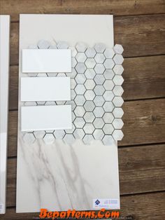 some white tiles and papers on a wooden table