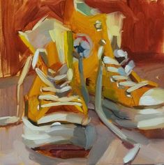 an oil painting of yellow sneakers with white laces