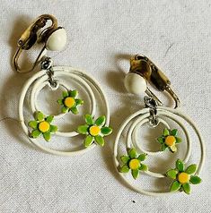 Vintage Enamel Earrings Cute Dasies In Circles Very 60s  | eBay Vintage Nickel-free Enamel Earrings, Vintage Dangle Earrings For Spring, Vintage Enamel Clip-on Earrings, Vintage Yellow Enamel Jewelry, Vintage White Dangle Jewelry, Retro Dangle Clip-on Earrings, Handmade Vintage Earrings For Spring, Retro White Dangle Earrings, Vintage Green Enamel Earrings