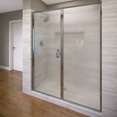 an empty room with a glass shower door