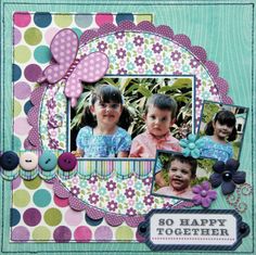 a scrapbook page with some pictures and buttons on the cover, including two children's faces