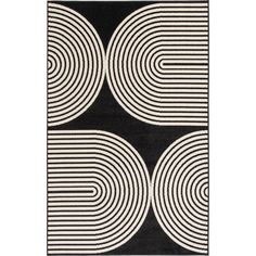 a black and white rug with circles on it