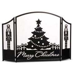 a black and white fireplace screen with a christmas tree on it's front side