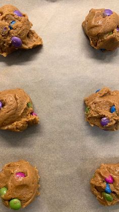 chocolate chip cookies with m & m's and easter eggs on the cookie sheet