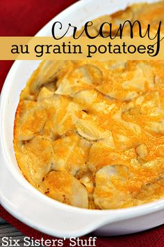 a casserole dish with potatoes in it on a red table cloth and the words creamy au gratin potatoes