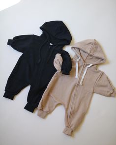 Our best selling jumpsuit will be such a staple in your little ones closet. Hood sweater jumpsuit with zipper closure Not fleeced Oversize fit Casual Long Sleeve Soft Onesie, Cotton Onesie For Loungewear, Super Soft Cotton Onesie For Loungewear, Unisex Long Sleeve Onesie For Loungewear, Casual Super Soft Long Sleeve Onesie, Cotton Hooded Onesie For Loungewear, Cozy Cotton Jumpsuits And Rompers For Fall, Cozy Hooded Cotton Onesie, Black Hooded Onesie For Loungewear