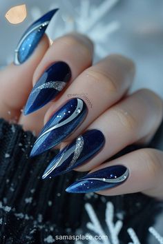 22 Blue Winter Nails Art Ideas and Designs Navy Elegant Nails, Blue Nails For New Years, New Year Nailart, 2025 Nails Design, Dark Blue And Silver Nails Acrylic, Elemental Nails, Almond Nails Blue Design, Silver And Navy Blue Nails, Unique Winter Nails