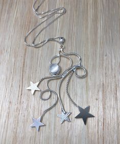 I've fabricated a celestial shooting star inspired necklace design, with your choice of 8mm cabochon gemstone, and this piece is fabricated entirely in sterling silver. It also comes with a 14 inch sterling silver box chain as the piece is meant to be worn more close to the collarbone. I can adjust the chain to any size, so please do specify a choice in the comments box! The pendant hangs approximately 3 inches from the chain and I've fabricated the piece in 16 gusge sterling silver. I've also p Handmade Star-shaped Celestial Necklace, Whimsical Star-shaped Jewelry With Star Charm, Celestial Silver Necklace With Star Charm, Silver Celestial Necklace With Star Charm, Celestial Dangle Necklace With Star Charm, Whimsical Silver Dangle Charm Necklaces, Celestial Star-shaped Nickel-free Necklaces, Star Charm Round Pendant Necklace For Jewelry Making, Nickel-free Star-shaped Celestial Necklaces