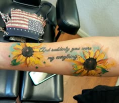 a sunflower tattoo on the arm that says, i am truly you are my everything