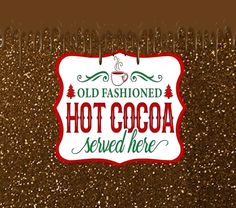 an old fashioned hot cocoa sign is displayed on a brown glittered background with red and green lettering