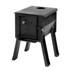 a black stove with legs and a hole in it