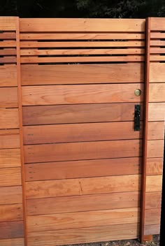 a close up of a wooden fence and gate