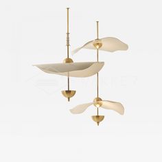 three white and gold ceiling fans hanging from the ceiling