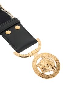 This Versace elastic belt is decorated with jacquard logo lettering, leather finishes and a '95 Medusa buckle in gold-finished brass, with a snap closure. The item shown in the photo corresponds to size S. Versace Gold, Versace Brand, Elastic Belt, Versace Sunglasses, Italian Luxury, Crossbody Tote, Gianni Versace, Pumps Flat, Leather Gloves