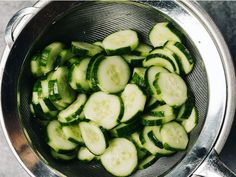 cucumbers in a strainer on the counter ready to be steamed or cooked