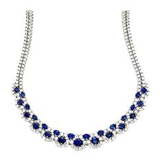 A stunning ladies 18k White Gold Natural Royal Blue Sapphire and Diamond Necklace made in the Province of Alessandra, Italy. The sapphires are Sri Lankan material and custom cut to a perfectly calibrated layout that slightly graduates. The natural round brilliants are collection quality (colorless and VS in clarity). The 16" necklace weighs 60+ grams and contains 303 stones (278 round brilliant diamonds weighing appx 19ct and 25 sapphires weighing appx 18ct). Luxury Sapphire Necklace With Baguette Cut, Luxury Gemstone Necklaces With Round Stone, Luxury Sapphire Single Strand Jewelry, Italian Necklace, Royalty Fashion, 16 Necklace, Boot Jewelry, Colorless Diamond, Royal Jewelry