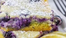 two slices of lemon blueberry cake on a plate