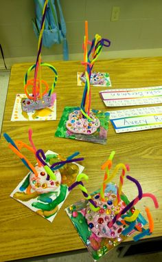 birthday candles are sitting on the table for children to make their own wish - comers